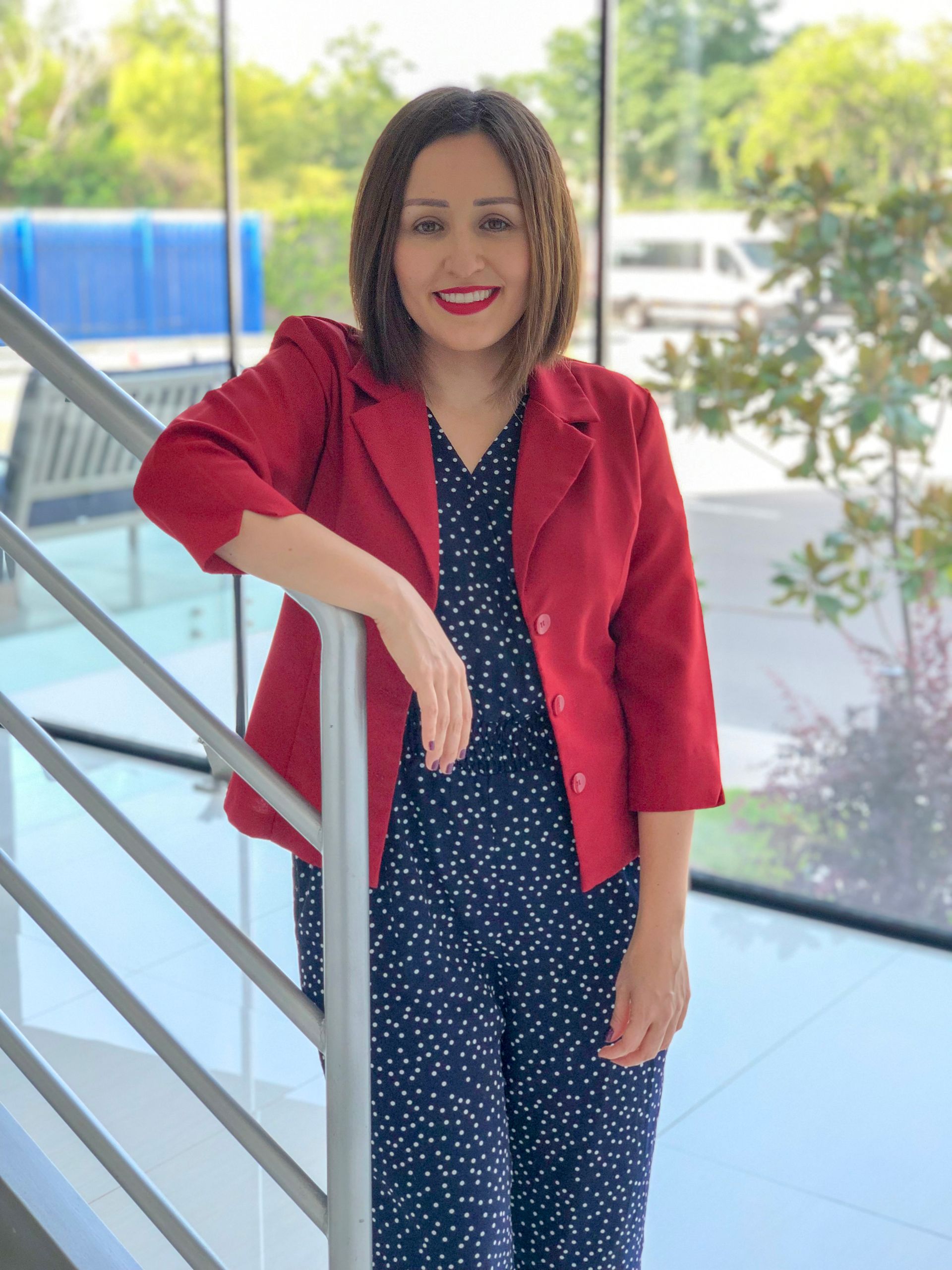 Erika, licensed therapist at SelfJourney Counseling, in a red blazer